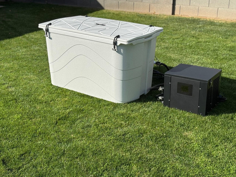 White Frozin cold plunge tub with its lid closed and connected chiller outdoors