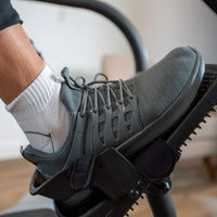 Shoe secured in an LXT-700 pedal with a heel cup and straps.