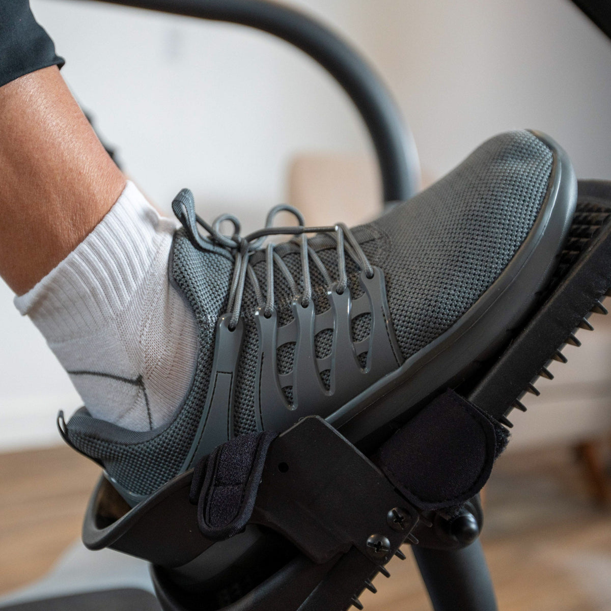 Shoe secured in an LXT-700 pedal with a heel cup and straps.