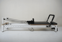 The Core Collab Full Track Queen Studio Pilates Reformer — Black Upholstery White Frame