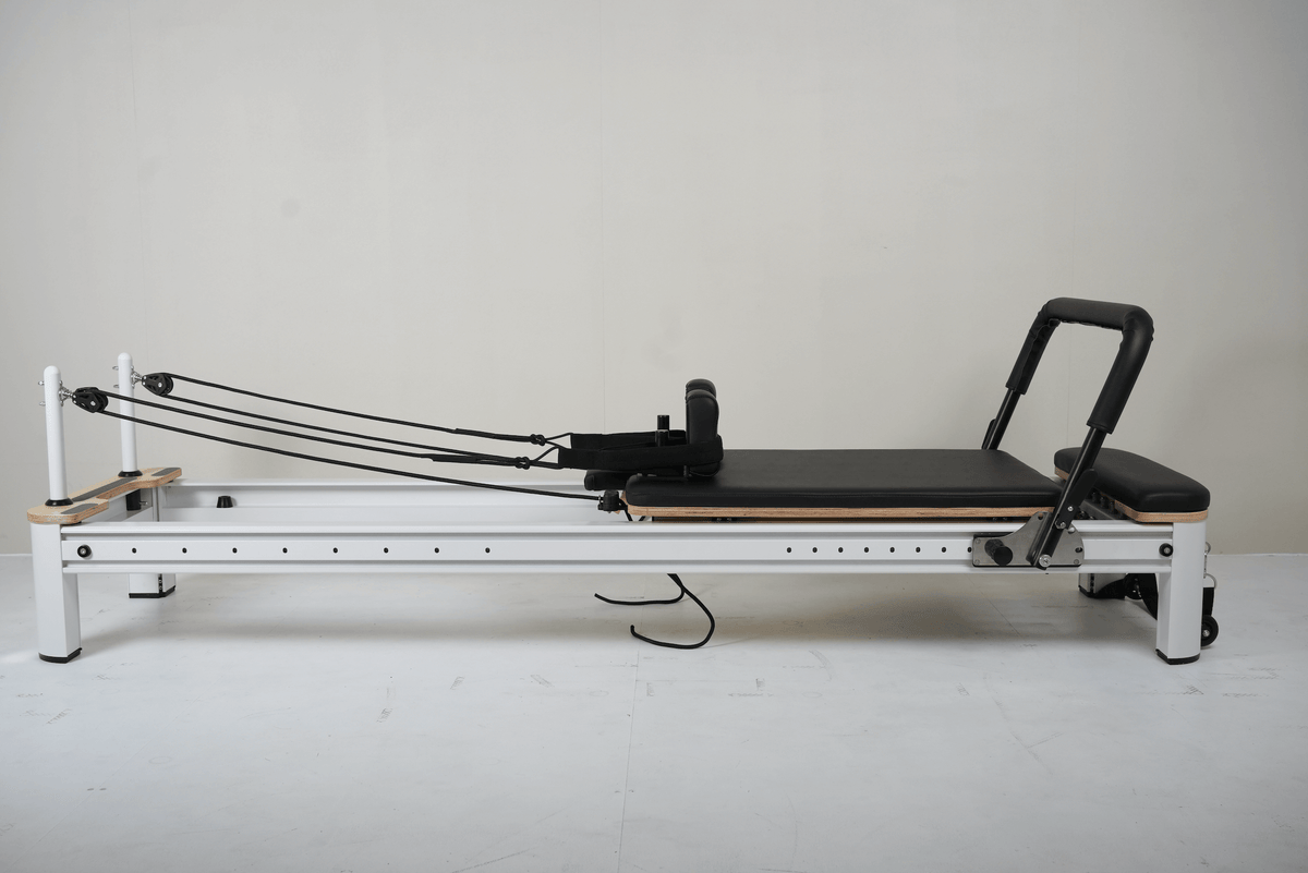 The Core Collab Full Track Queen Studio Pilates Reformer — Black Upholstery White Frame