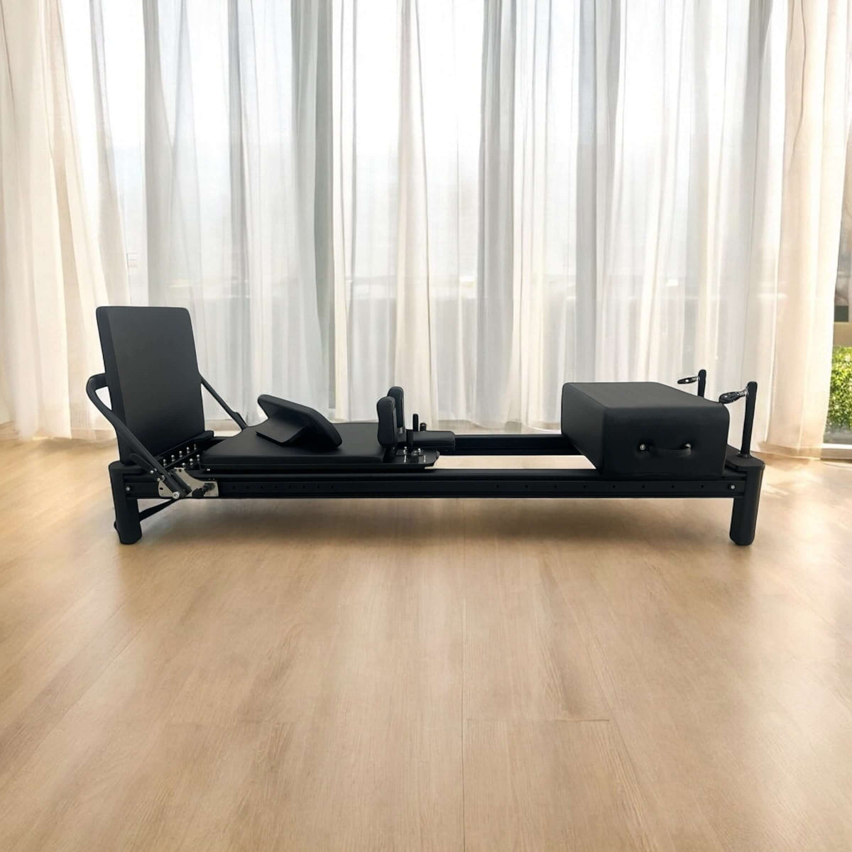 The Core Collab Full Track Queen Studio Pilates Reformer — Black Upholstery Black Frame