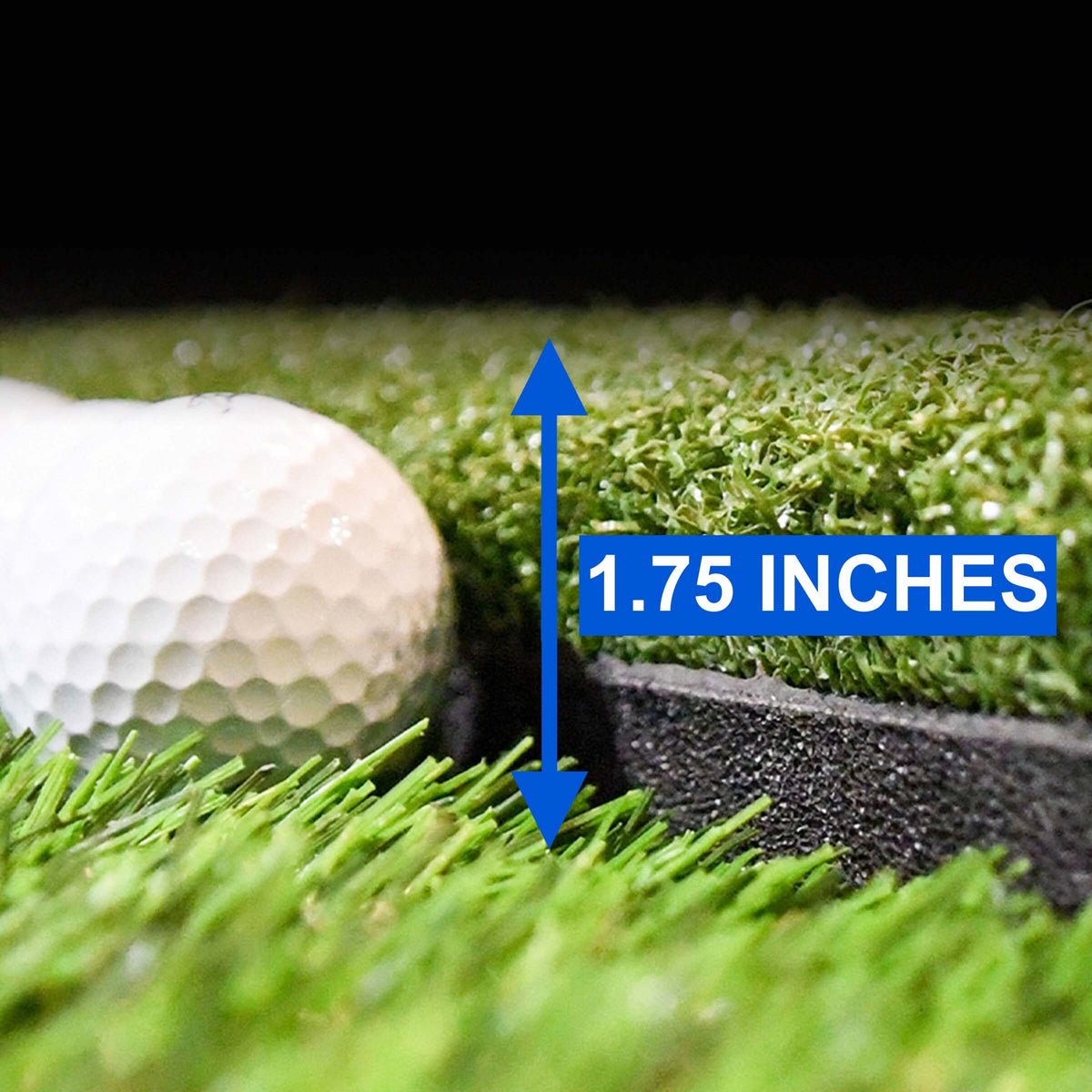 Golfer mid-swing on a HotShot mat in a simulator bay