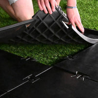 Installing the HotShot mat over interlocking base tiles
